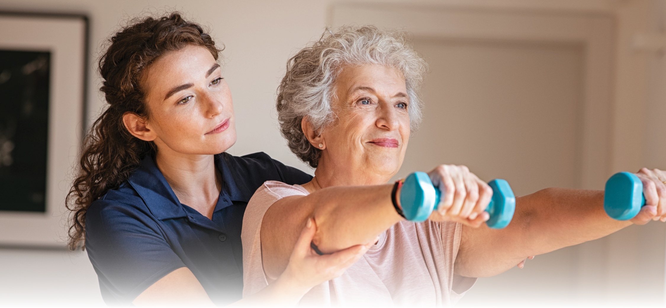 Senior physical therapy with dumbbells