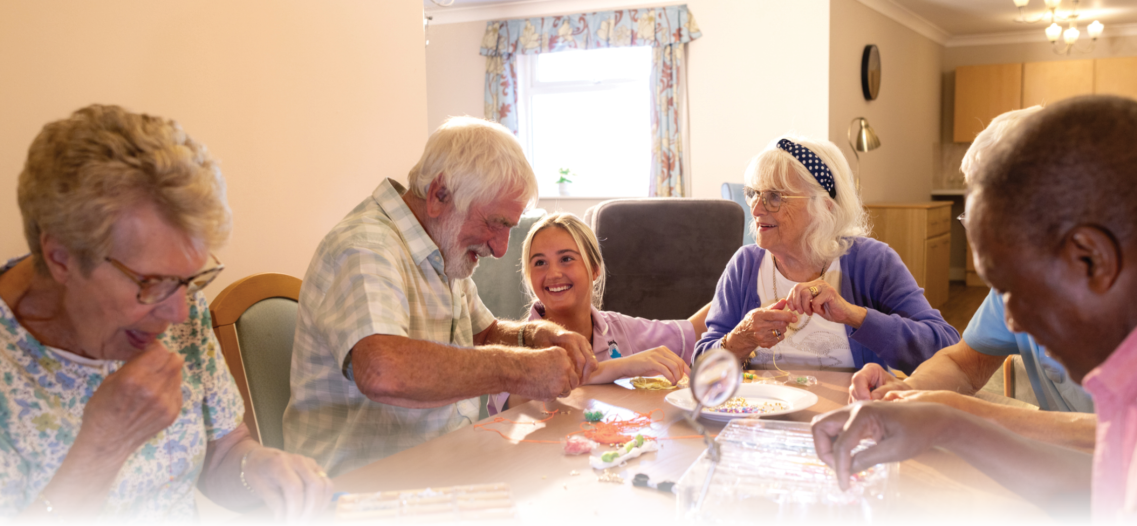 Residents in assisted living facility doing crafts
