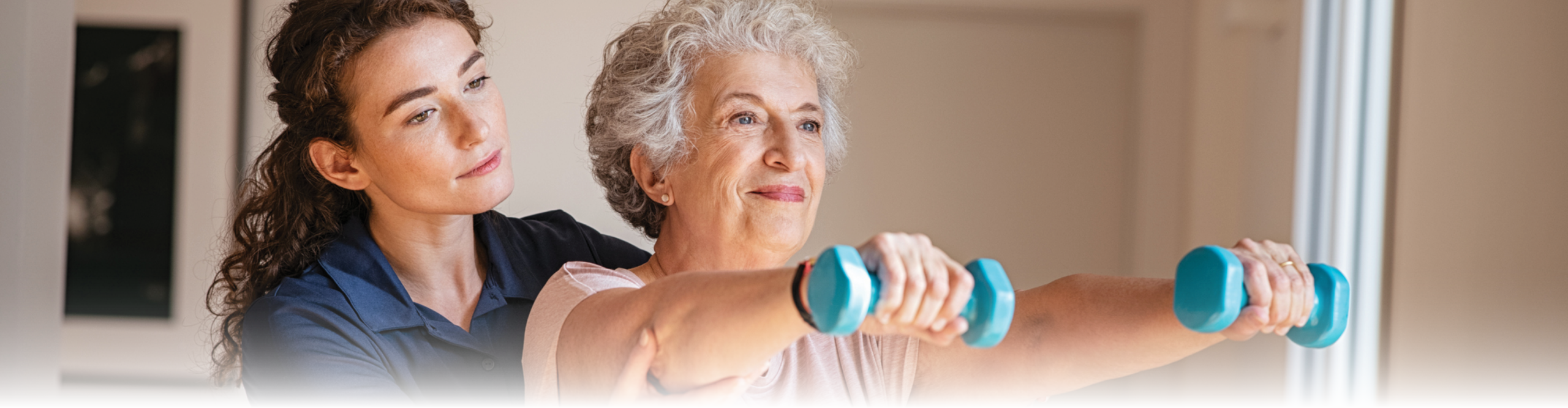 Senior physical therapy with dumbbells
