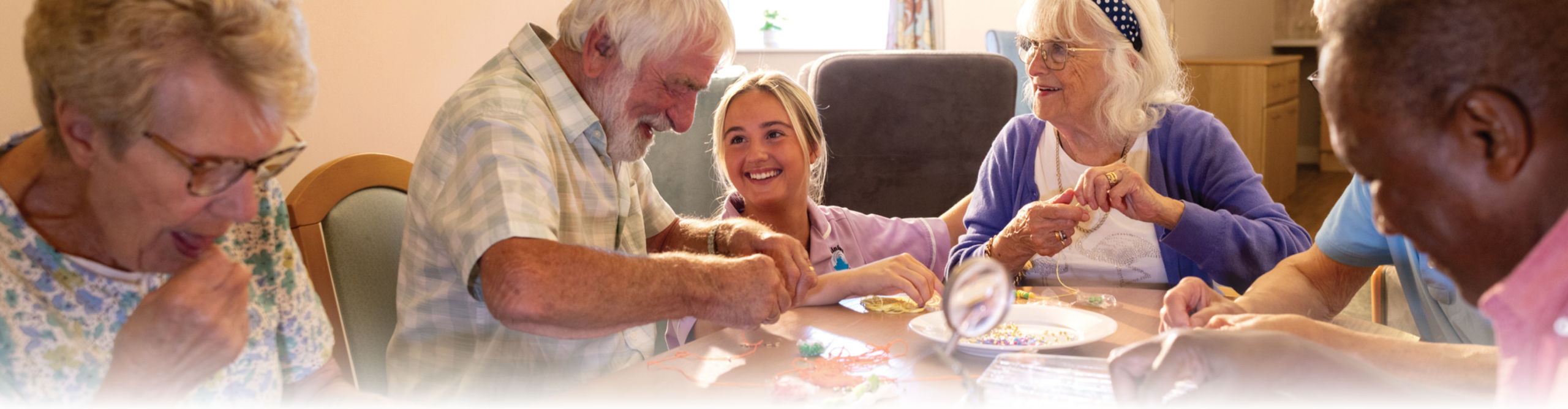Residents in assisted living facility doing crafts
