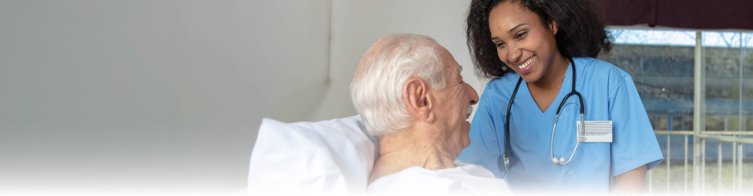 Nurse smiling at senior man